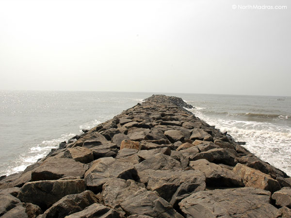 A path leading into the sea, which shows the roughness of the sea.